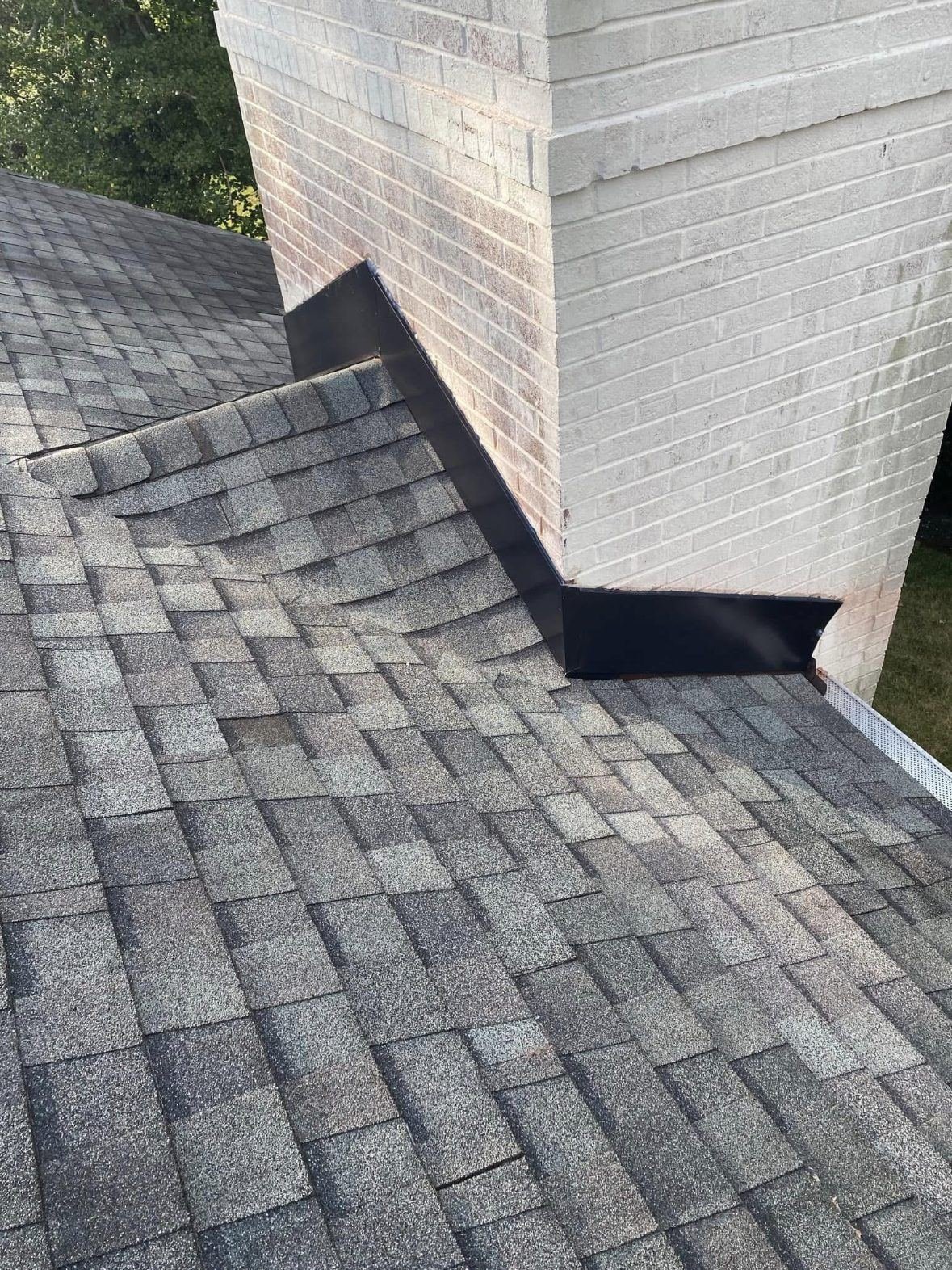 Chimney flashing repair on a Brentwood roof