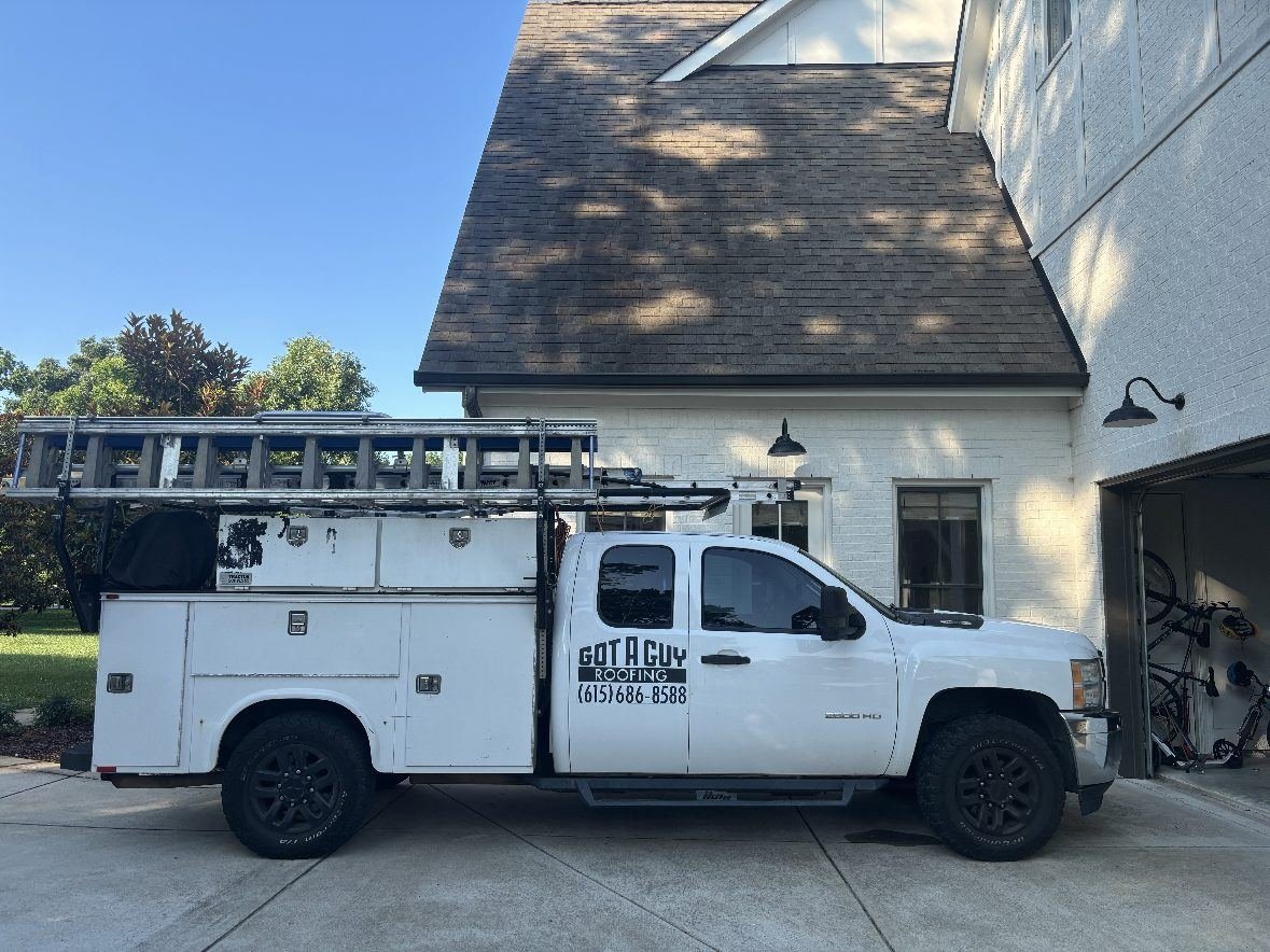 Got A Guy Roofing branded work truck parked at a Nashville job site