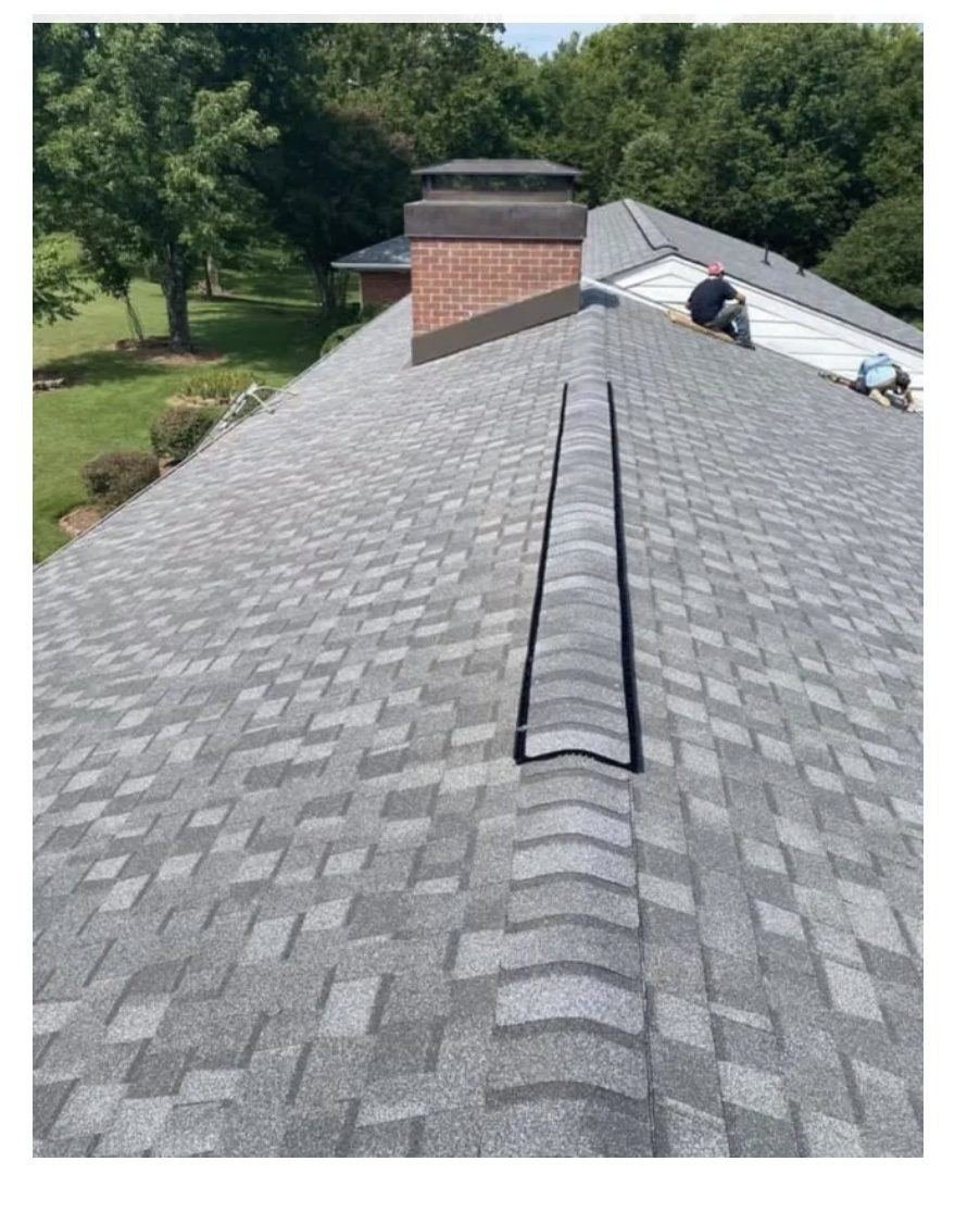 Freshly shingled roof with brick chimney on a Crieve Hall home in Nashville