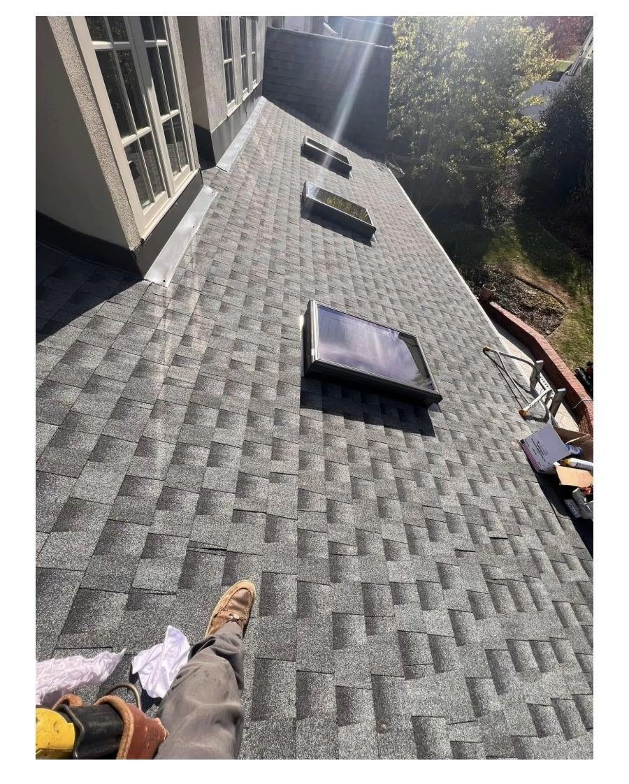 Completed shingle roof with skylights on a Belle Meade home